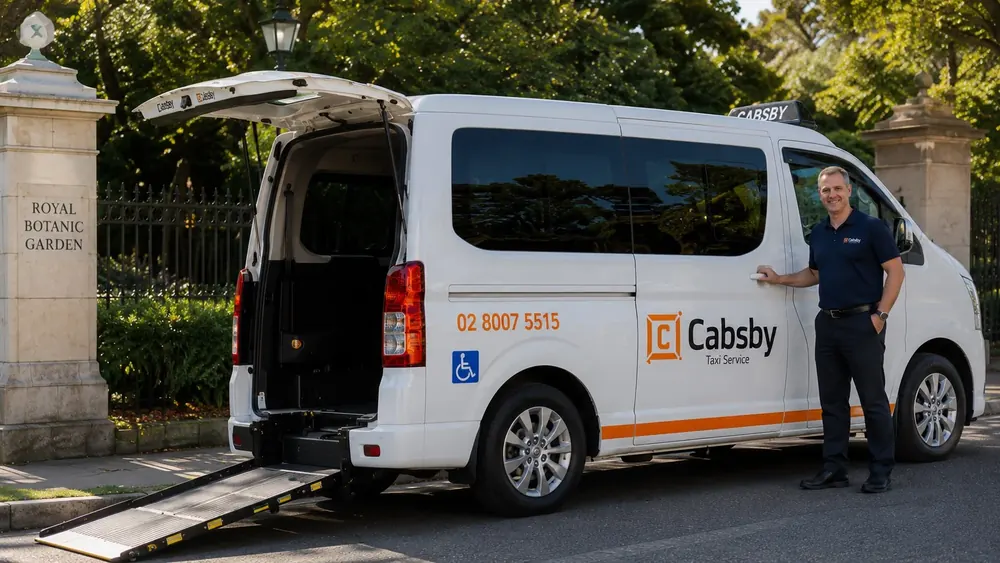Driver assisting a wheelchair user with rear ramp loading